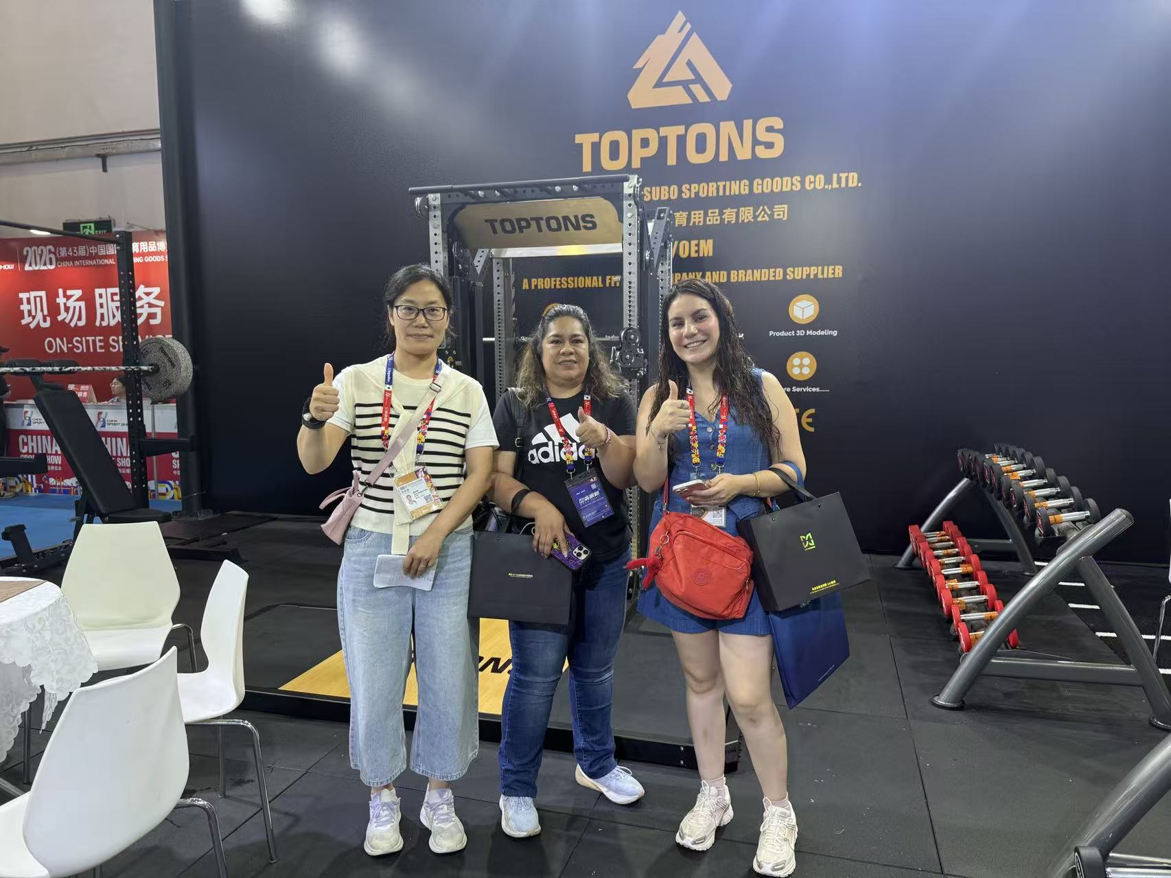 TOPTONS representative with customers at a 2026 exhibition